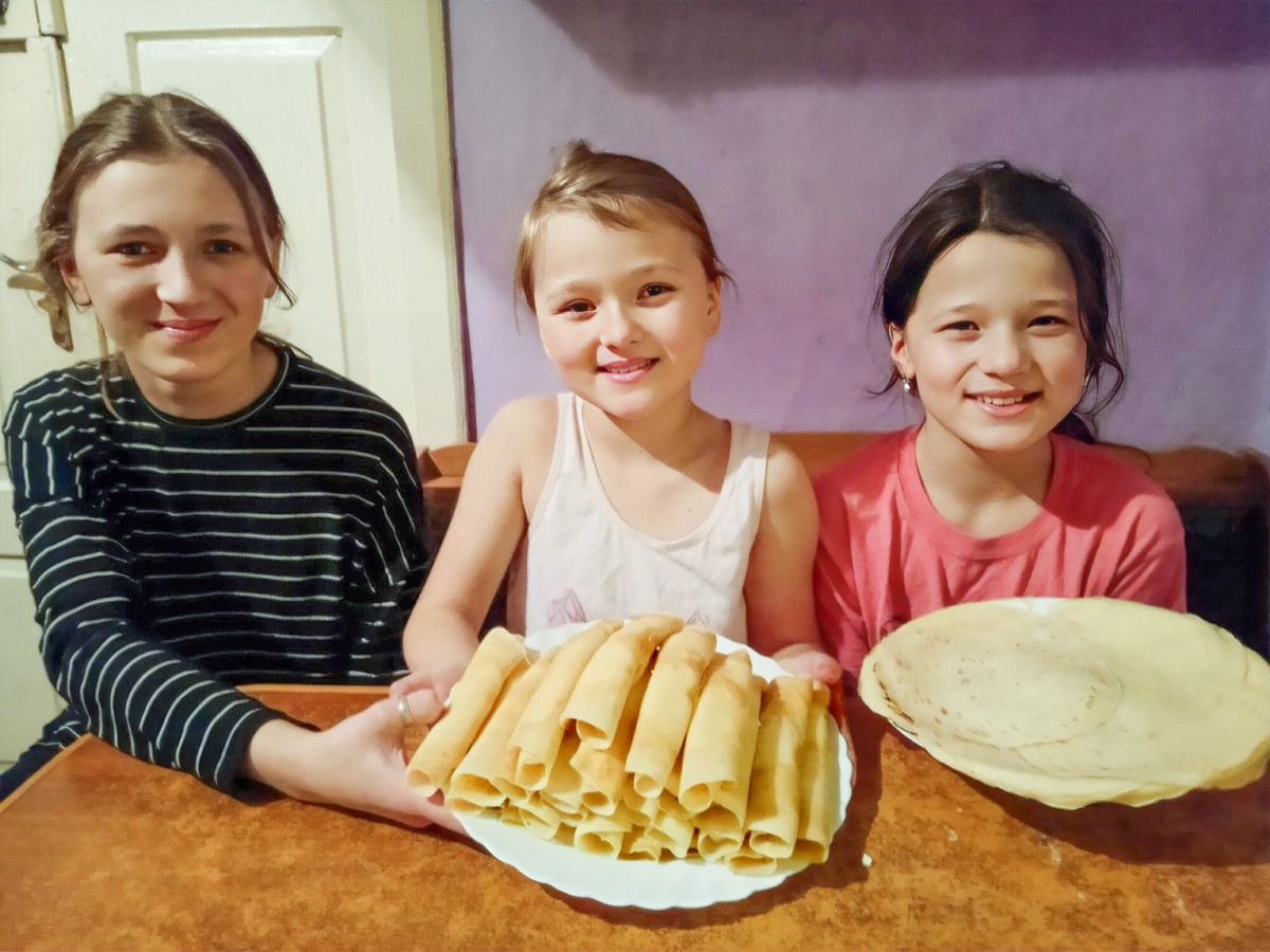Ukraine Ternopil family crepes pancakes smile shrove lent lunch