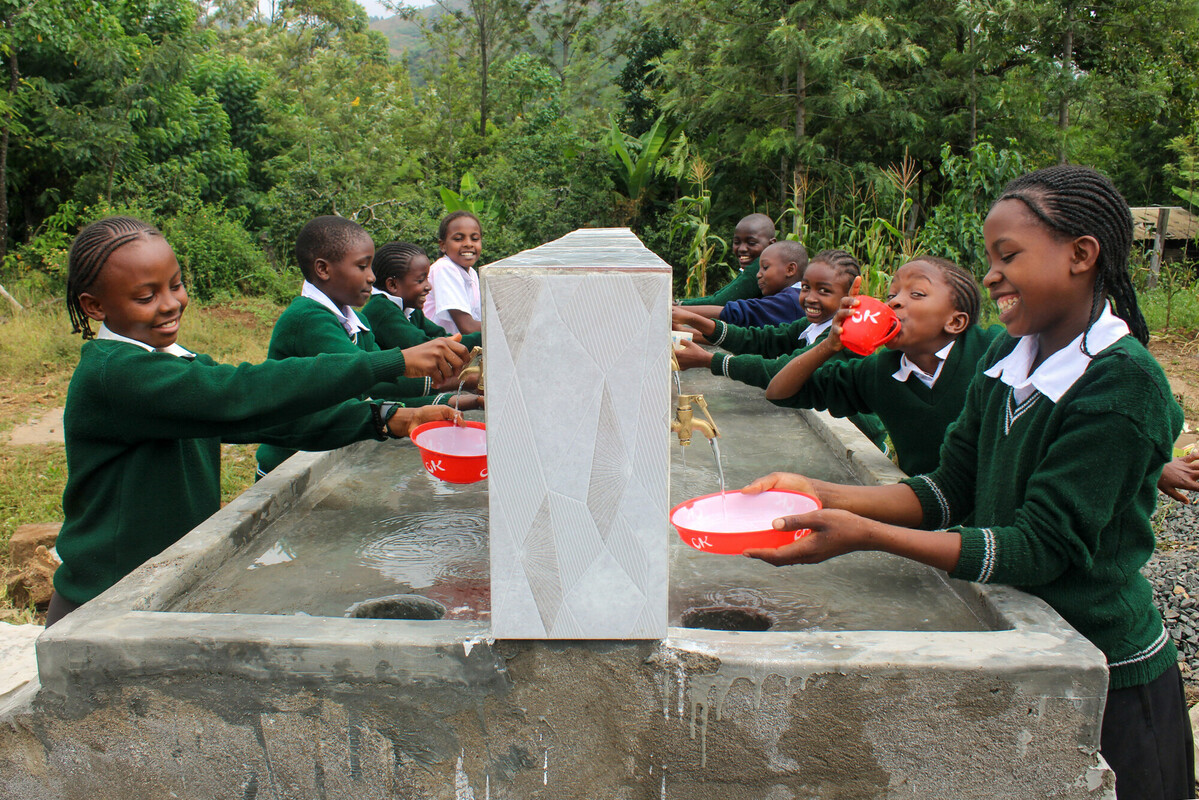 Mikinduri mt carmel student group taps smile wash plates