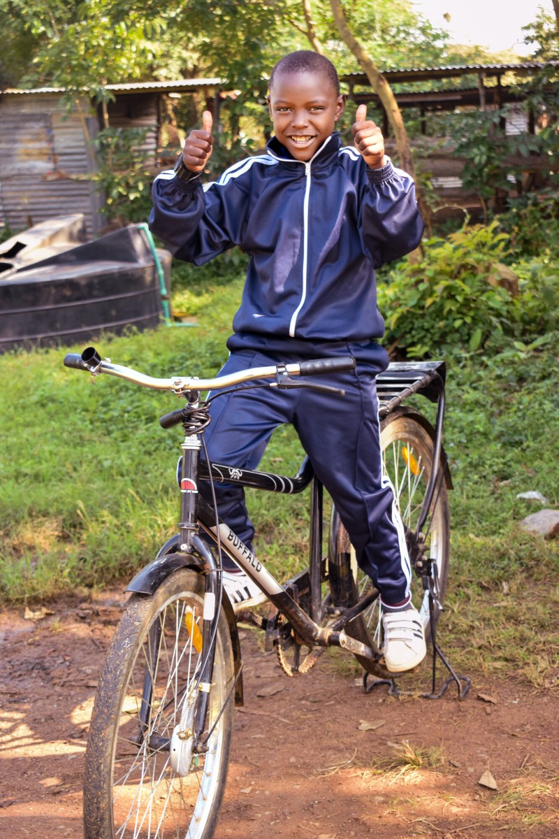 Chris with new bicycle Chalice Asembo Kenya