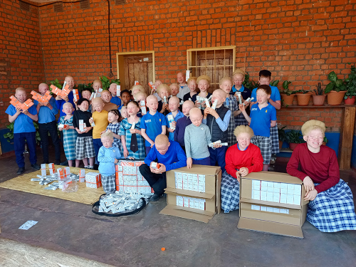 Children in Zambia are happy to recive medicated soap and lotion