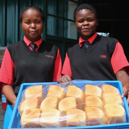 students in Kenya showing their baked bread